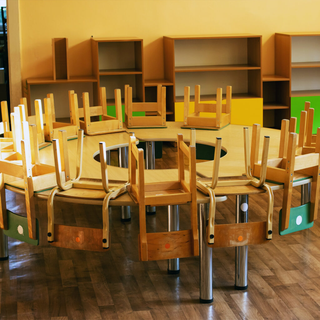 A set of wooden chairs arranged on a table