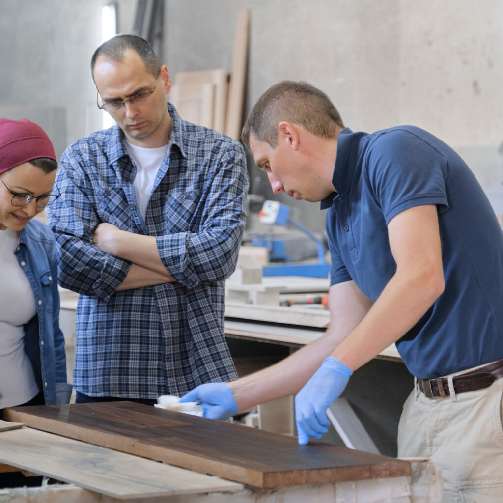 Two people examining a carpentry work of a carpenter in Dubai